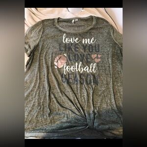 Cato Military green football themed shirt.